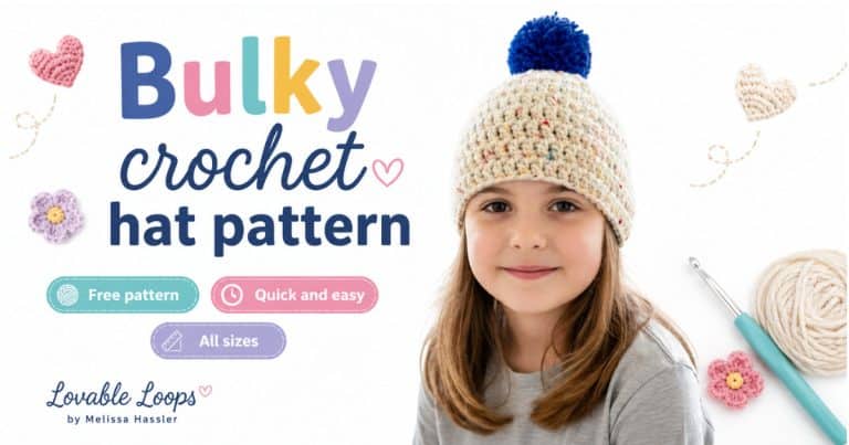 Smiling girl wearing a cream speckled crochet hat with a blue pom-pom in a bright neutral room.