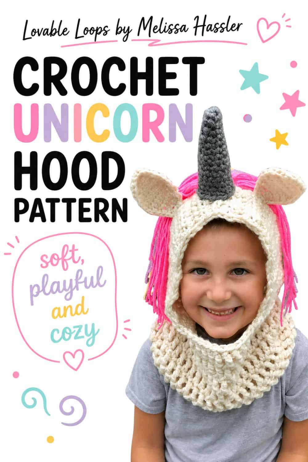 Child wearing a cream crochet unicorn hooded cowl with a dark gray horn, cream ears, bright pink yarn mane, and chunky textured neck warmer on a white background.